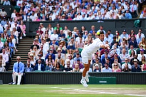 Novak Djokovic launches himself at the ball.
