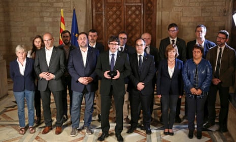 Carles Puigdemont, centre, and his Cabinet giving a press statement on the Catalonia independence referendum.