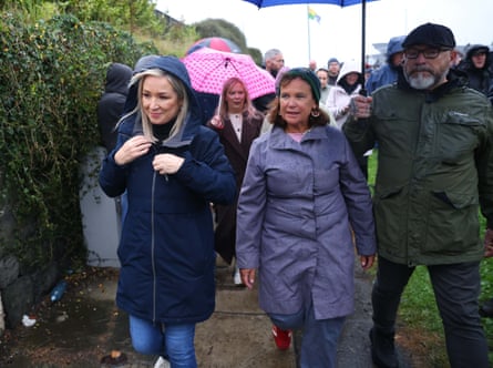 O’Neill and McDonald walk in the rain