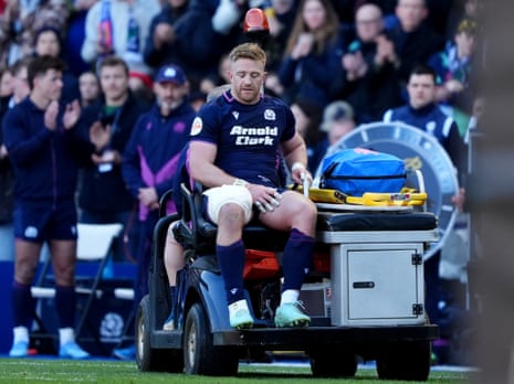 Scotland's Kyle Steyn leaves the field after picking up a gash to his leg while failing to stop France's Antoine Dupont scoring a try.