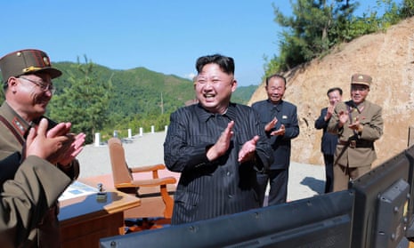 Kim Jong-un and North Korean officials celebrate the launch last November of a Hwasong-14 missile that landed in the Sea of Japan.