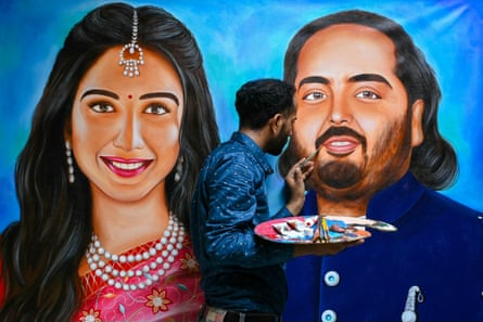 Artist Jagjot Singh Rubal paints portraits of the happy couple.