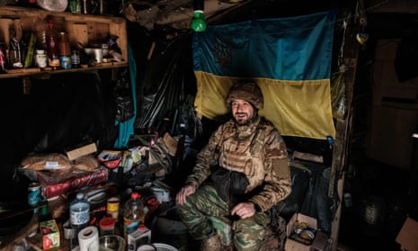 A Ukrainian soldier sits in their bunker at a front line near Toretsk in the Donetsk region on 12 October.