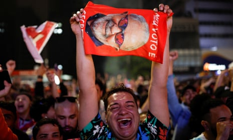 A supporter of former President and presidential candidate Luiz Inacio Lula da Silva reacts as people gather after polling stations were closed in the presidential election, in Sao Paulo, Brazil 2 October 2022.