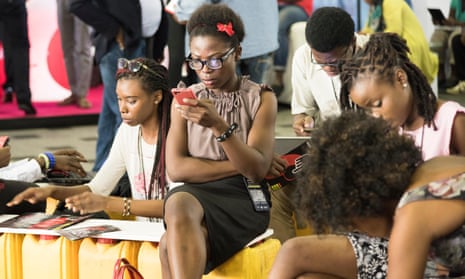 Young Nigerian women using mobile phones