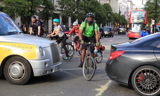 Bike-car gridlock at a junction on Oxford Street in London’s West End.