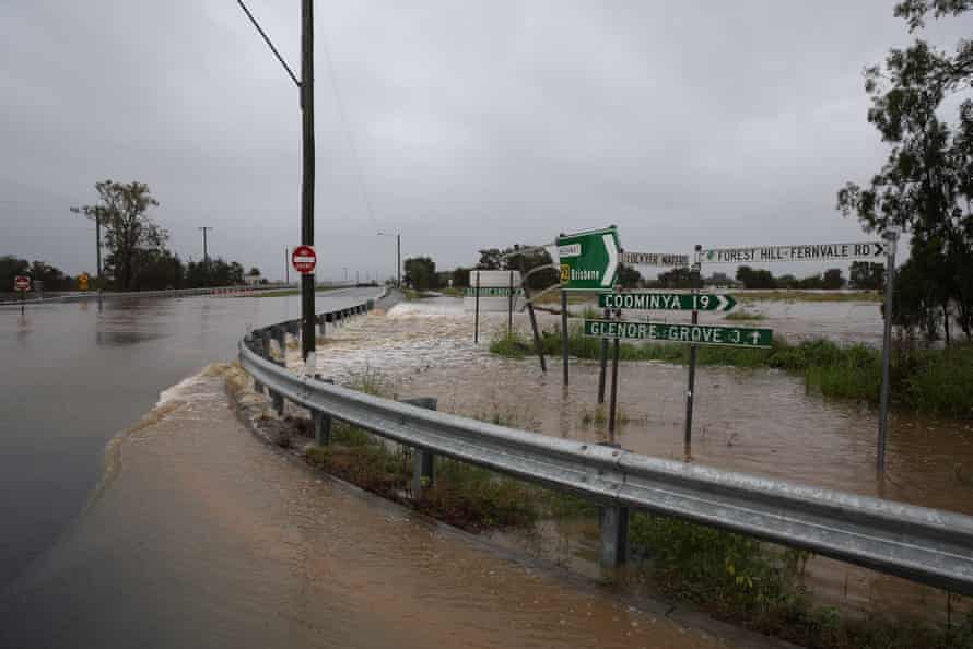 Flood waters cut the Warreg Highway in Plainland.