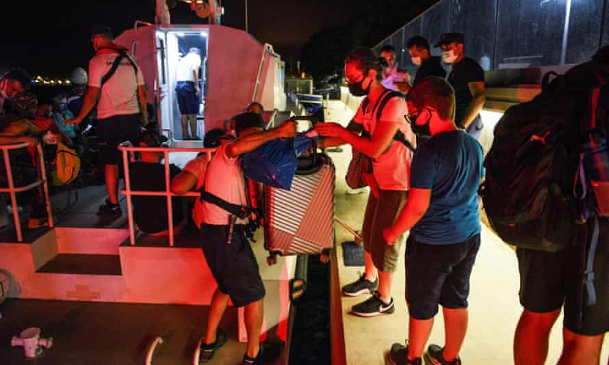 After the fire spread to a coal-fired power plant in Oeren, people boarded a coast guard ship and evacuated the area.