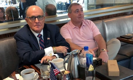 Donald Trump’s personal lawyer Rudy Giuliani has coffee with Ukrainian-American businessman Lev Parnas at the Trump International Hotel in Washington, on Friday.