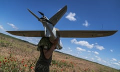 Ukrainian soldier carries a Leleka 100 intelligence drone near Chasiv Yar, Donetsk oblast