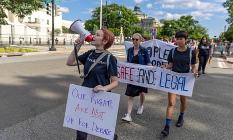 Protesters march near the supreme court to demand an end to gun violence and call for abortion rights protection on Saturday.