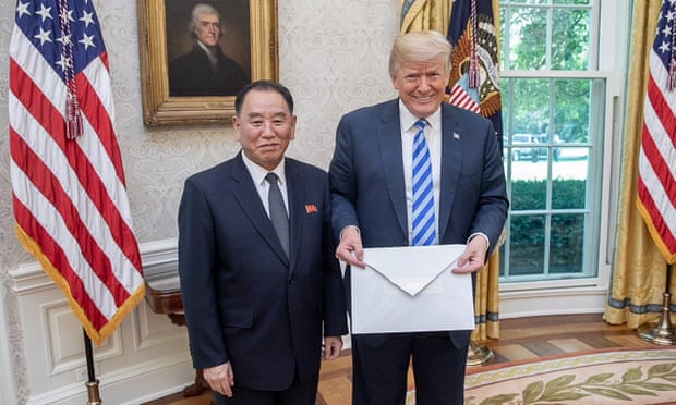 Trump with the big envelope given to him by Kim Yong-chol.