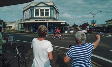 People wave at Australia cyclist Lachlan Morton cycling between Wellington and Auckland