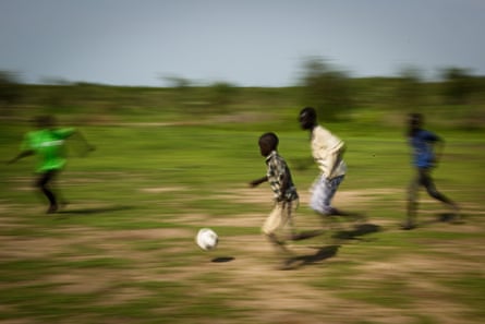 Children play football at the Pibor youth centre.