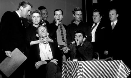 That Was the Week That Was cast members at BBC Television Centre in 1963. Standing, from left to right: David Frost, Millicent Martin, Irwin C Watson, Kenneth Cope, David Kernan, Willie Rushton and Robert Lang. Seated are Lance Percival and Al Mancini.