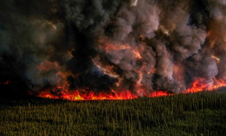 Smoke billows upwards from a planned ignition by firefighters tackling the Donnie Creek Complex wildfire south of Fort Nelson, British Columbia, Canada June 3, 2023.