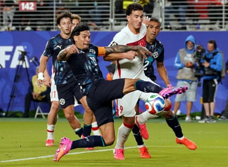 Paraguay's Gustavo Gomez in action with Turkey's Deniz Gul.