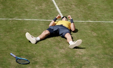 Draper splays out on the court after beating Matteo Berrettini in the final in Stuttgart