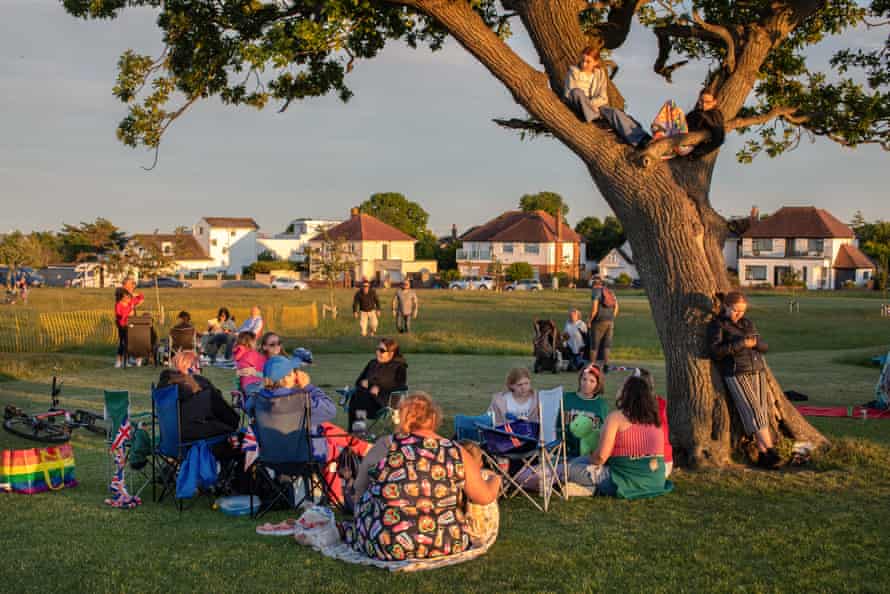 A number of families gather in the evening at Penarth Cliff Tops for the lighting of the fire beacons which will begin the Queen's Platinum Jubilee celebrations.