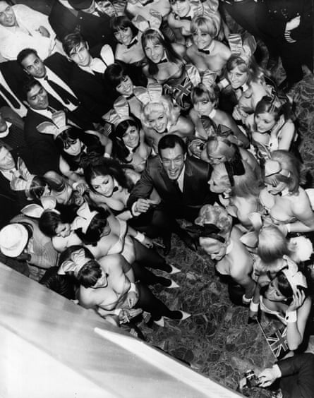 Bunny Girls Playboy' publisher Hugh Hefner photographed from above, surrounded by Bunny Girls