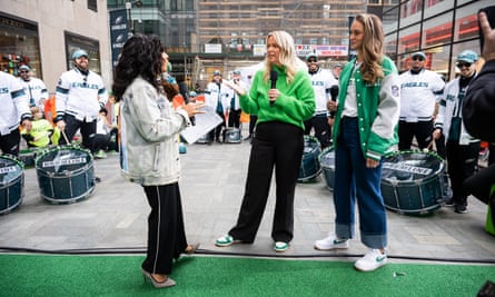 three women with microphones outside a building