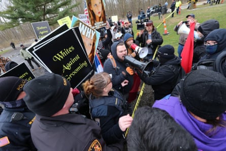 Protesters confront each other with one side holding signs saying ‘Whites against grooming’.