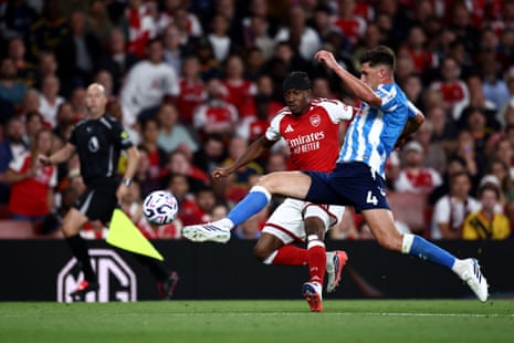 Bobby Thomas controls the ball whilst under pressure from Noni Madueke.