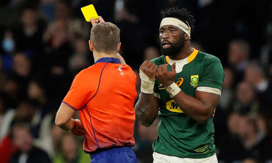 Siya Kolisi of South Africa receives a yellow card for a tackle against England's Joe Marchant.