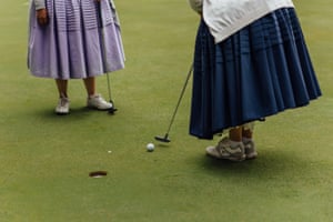 A close-up of a woman putting