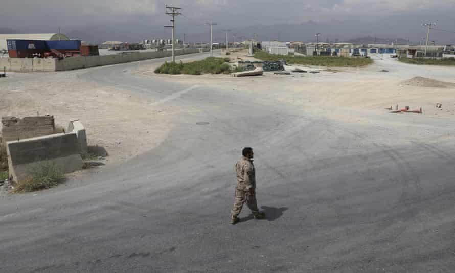 A member of the Afghan security forces walks in the sprawling Bagram airbase