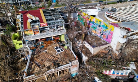 Buildings and trees damaged after a hurricane.