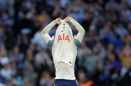 Xavi Simons pulls his shirt over his head in anguish