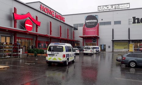 Police vans in front of the shopping centre where the Savo Vocational College is located in Kuopio, Finland, following an attack