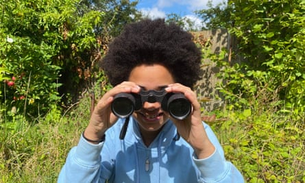 A child observing a flower