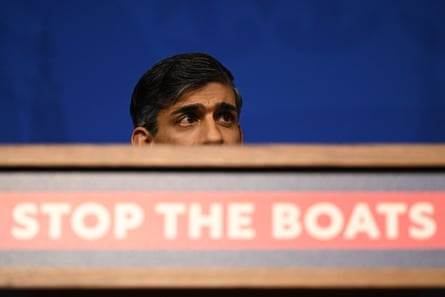 Rishi Sunak’s head atop a ‘stop the boats’ sign