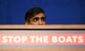 Rishi Sunak's head above a 'stop the boat' sign
