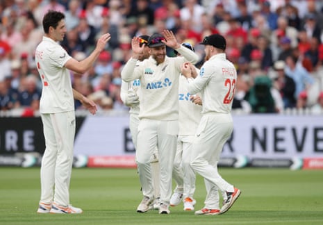 New Zealand's Will O'Rourke celebrates with teammates after taking the wicket of England's Ben Duckett.