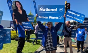 Judith Collins holds a National party hoarding at an intersection on Auckland’s North Shore.