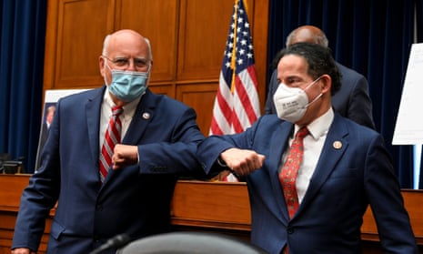 Robert Redfield, director of the Centers for Disease Control and Prevention (CDC), left, and United States Representative Jamie Raskin (Democrat of Maryland), wear protective masks while greeting each other with an elbow bump after a House Select Subcommittee on the Coronavirus Crisis hearing in Washington, D.C. Trump administration officials are set to defend the federal government’s response to the coronavirus crisis at the hearing hosted by a House panel calling for a national plan to contain the virus.