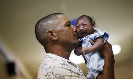 Geovane Silva holds his son Gustavo Henrique, who has microcephaly, at the Oswaldo Cruz Hospital in Recife, Brazil, in 2016. 