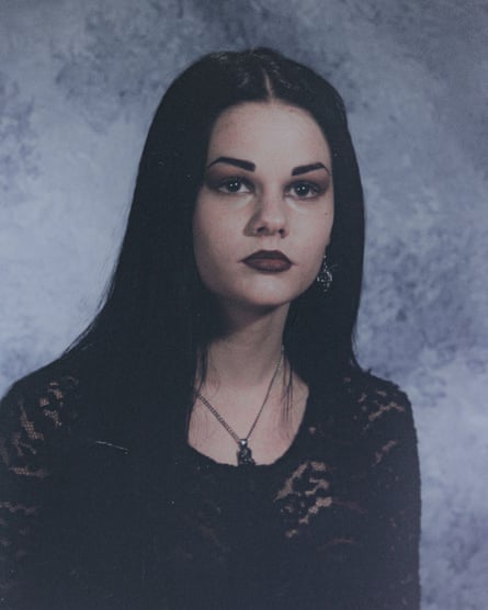 A teenage girl wearing black lipstick and black clothes