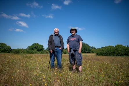 Prof Sayer and Derek Sayer stood beside one another in the meadow
