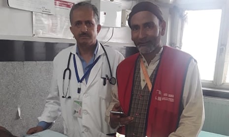 Shabir Hussain Khan with a doctor in a Kashmir hospital