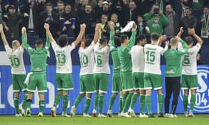 Werder Bremen players and fans celebrate after their 2-0 win at Schalke earlier this month.