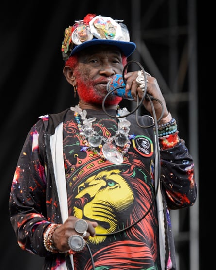 A colourfully dressed, ageing Lee ‘Scratch’ Perry on stage in Chicago, 2015.