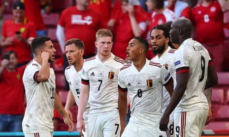 Belgium’s midfielder Kevin De Bruyne celebrates with teammates after scoring his team’s second goal against Denmark.