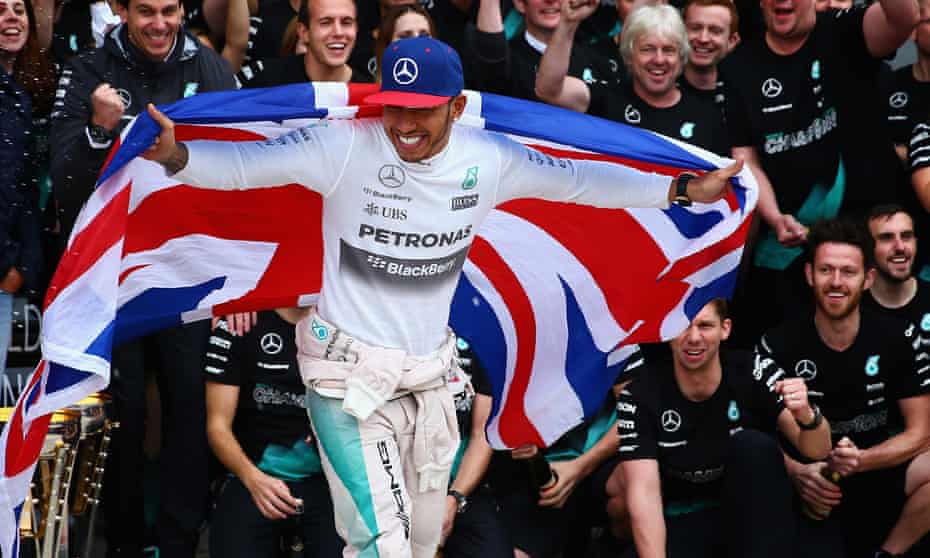 Lewis Hamilton celebrates winning the race and the 2015 F1 world championship.