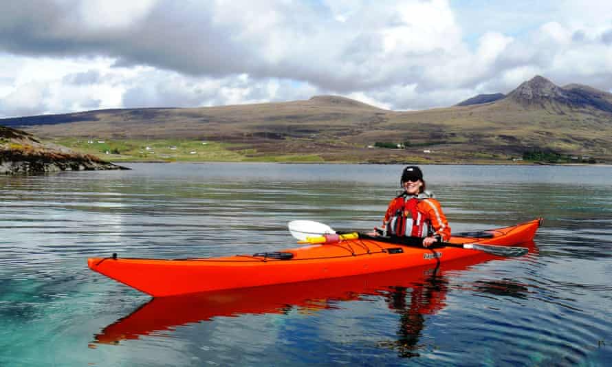 Woman Sea kayaking, north-west coast of Scotland