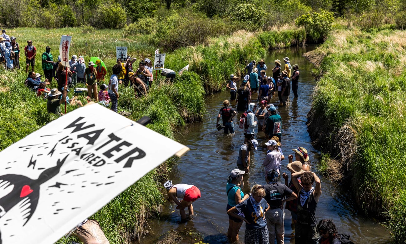 Climate activists and Indigenous community members march to protest the construction of the Enbridge Line 3 pipeline in Solvay, Minnesota, in June.