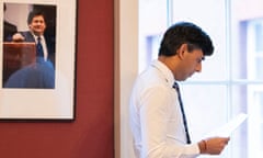 Rishi Sunak with a portrait of Nigel Lawson on a wall behind him
